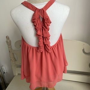 Coral ruffle back chiffon top.